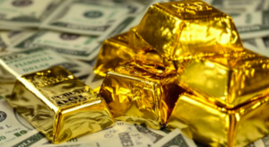 El dólar se debilita y el oro escala mientras se acerca el dato clave de empleo